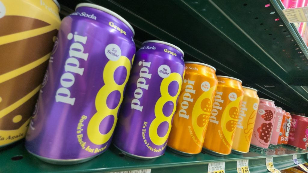 Cans of Poppi Brand Drink Products on Store Shelf at Harris Teeter